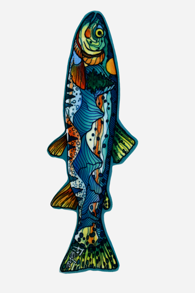 A colorful patch in the shape of a fish with mountainous terrain and a blue sky depicted on it, designed for outdoor gear.