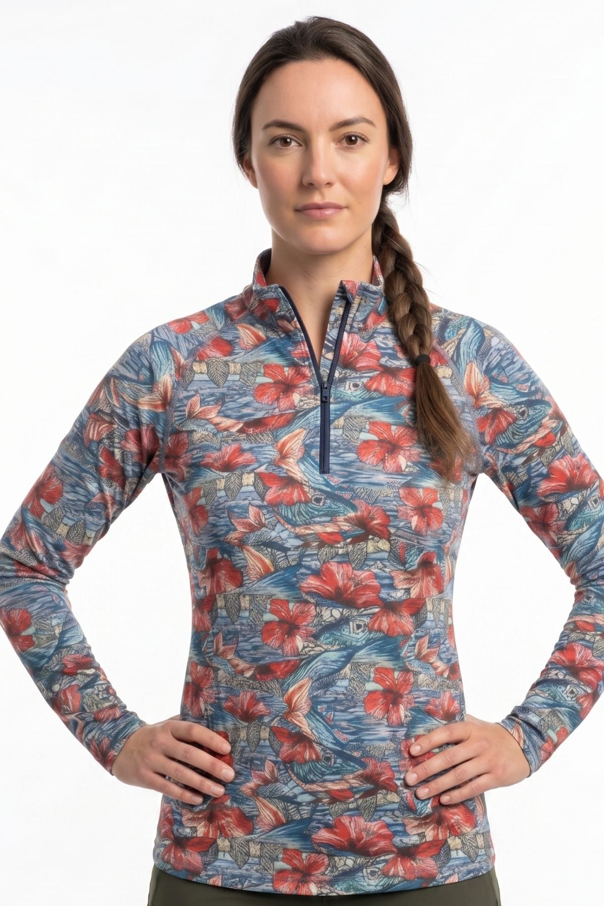Woman wearing a colorful floral-patterned long-sleeve shirt on a white background