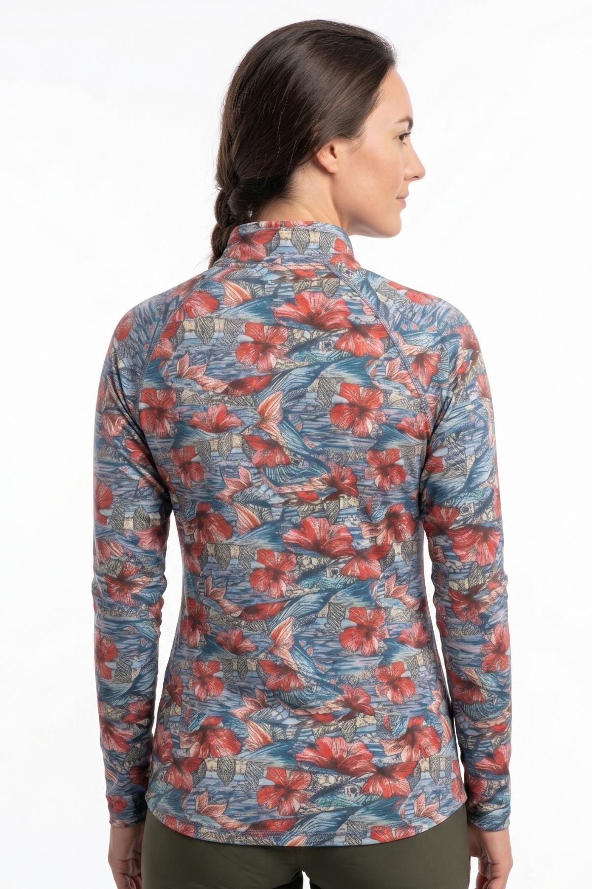 Woman wearing a floral patterned long-sleeve shirt on a white background