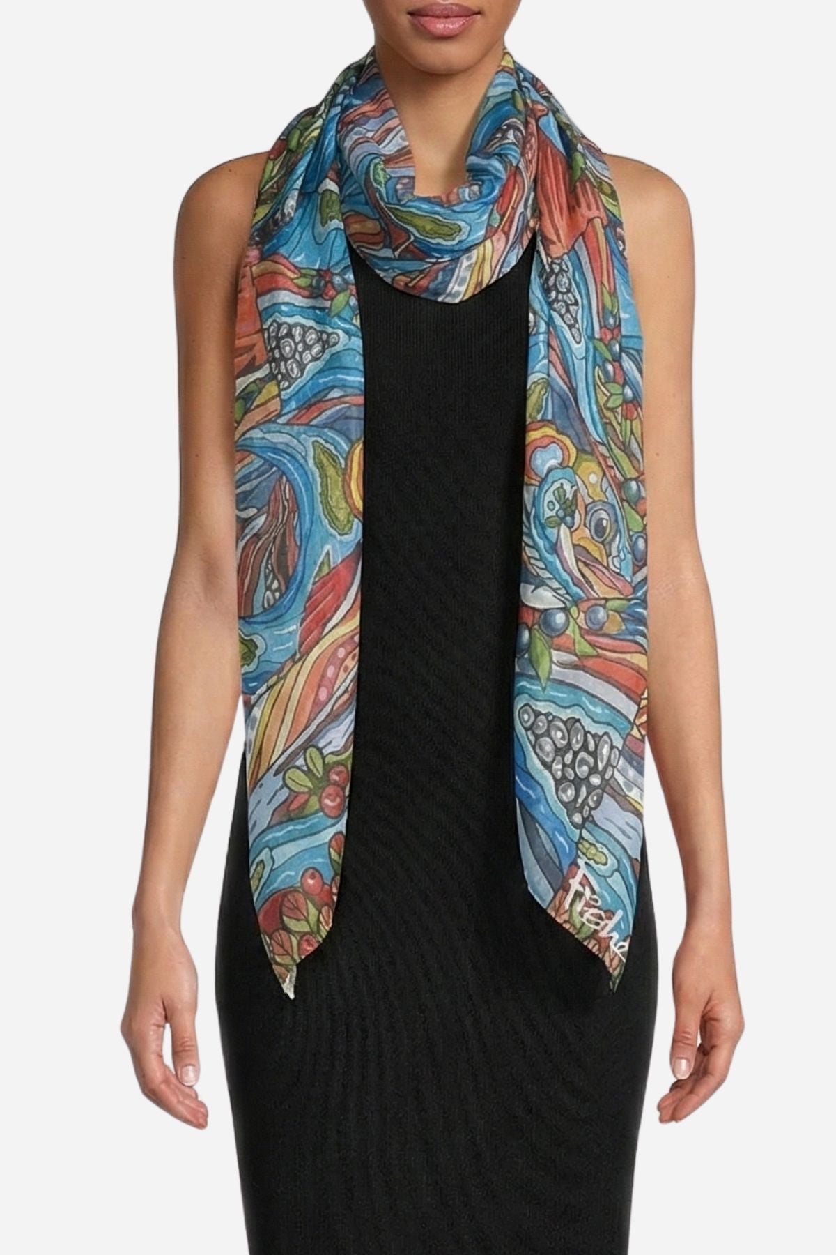 Woman wearing a colorful patterned scarf on a white background