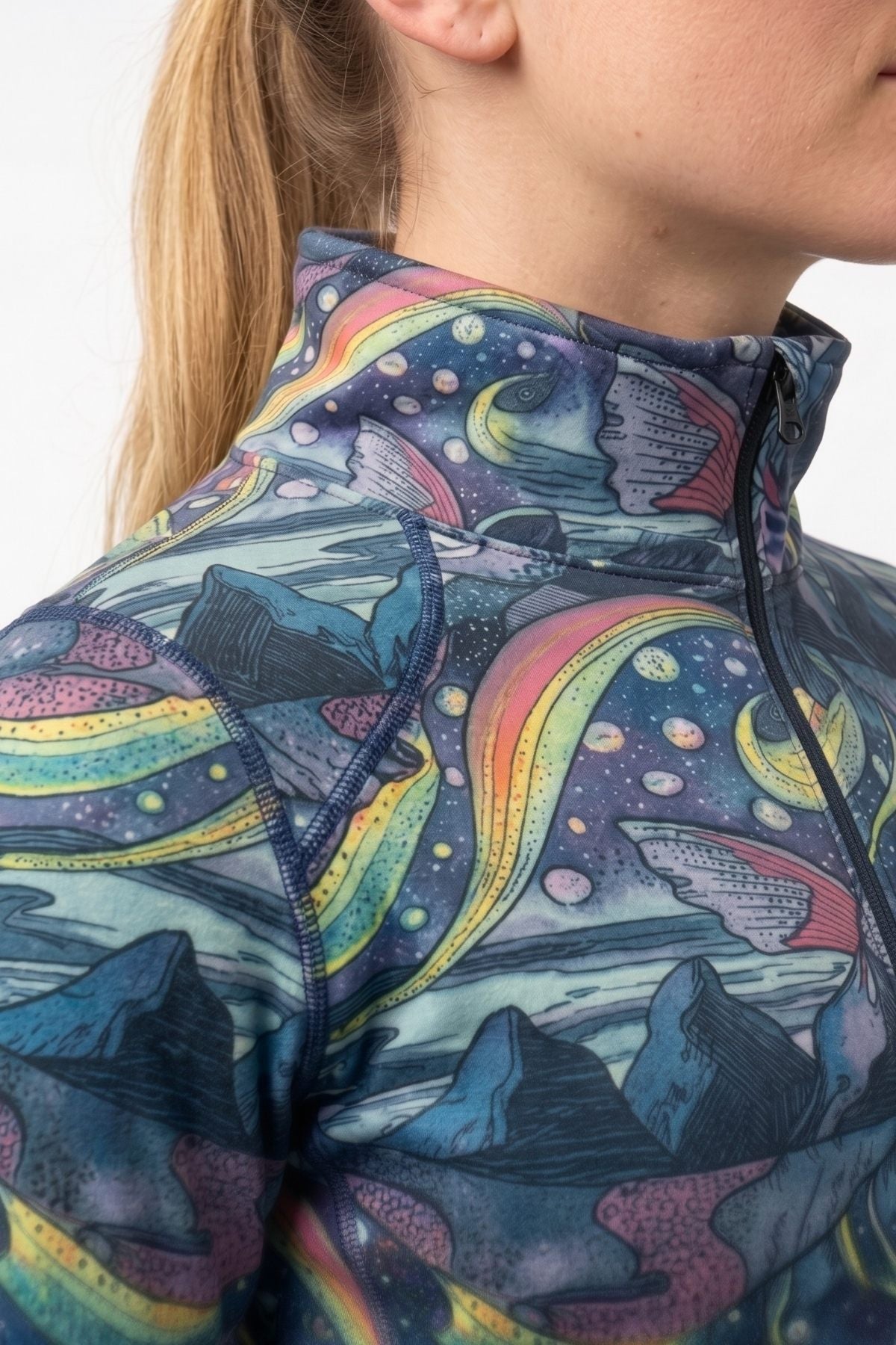 Close-up of a colorful jacket with nature-themed design on a plain background