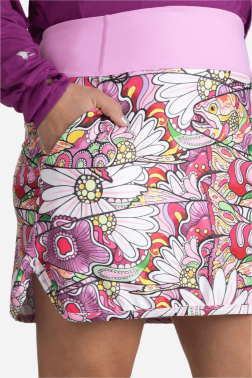 A skort with a floral pattern, predominantly in pink, purple, and white colors, with a visible pink waistband and pockets on the sides.