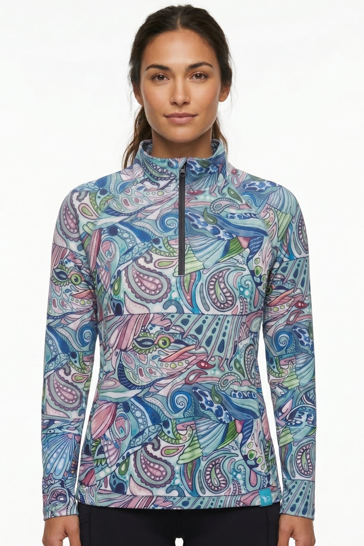 Woman wearing a colorful patterned long-sleeve shirt on a white background