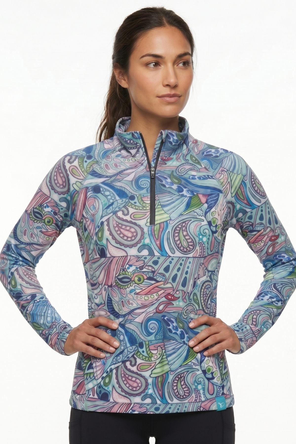 Woman wearing a colorful patterned long-sleeve shirt on a white background
