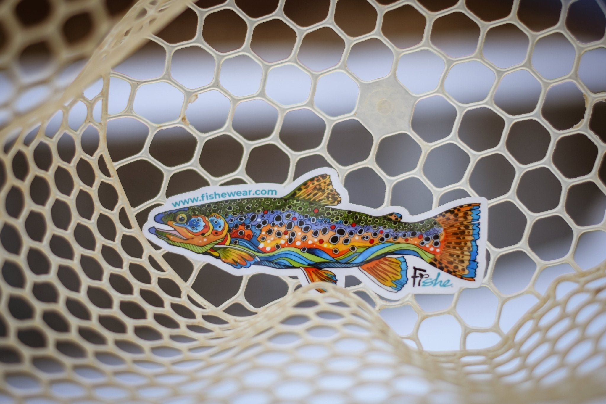 Angler wearing the Fishe Unbound Brown trout pattern outdoors