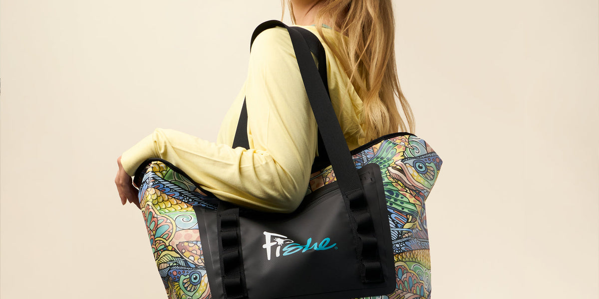 Fishe founder Linda Leary with a colorful Fishe tote in the studio