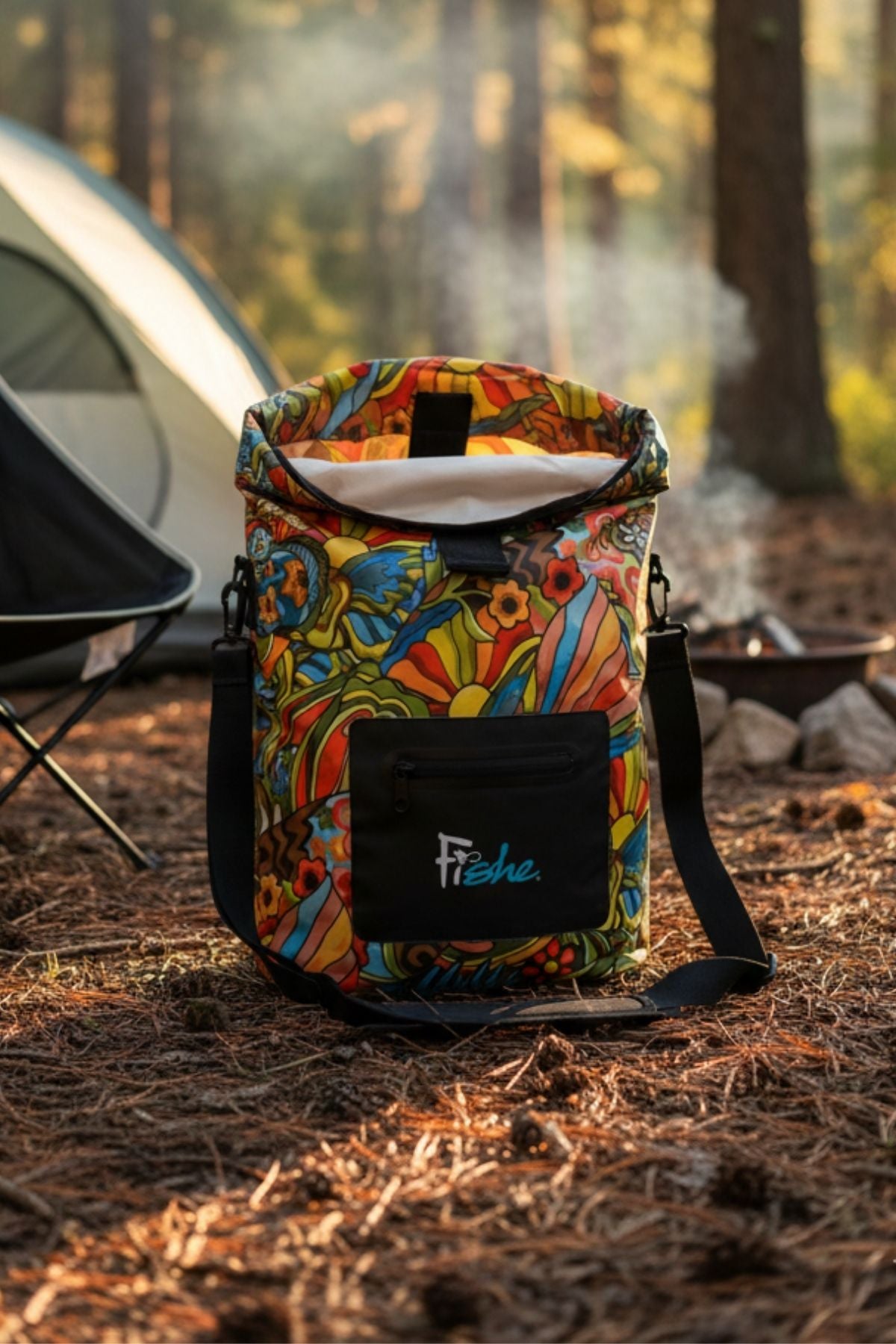 Colorful patterned bag with 'Fiske' branding in a forest setting