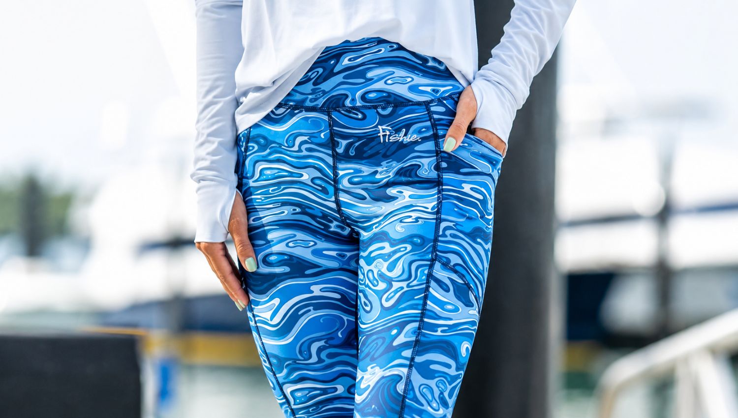 Person wearing blue patterned leggings with a blurred background