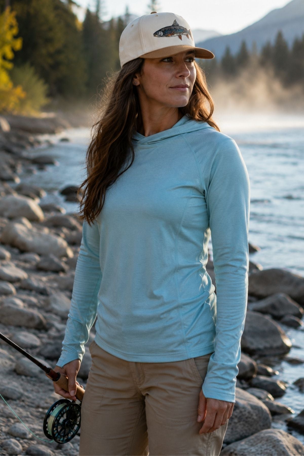 Dolly Vee Twill Trucker Hat shown in an outdoor lifestyle setting