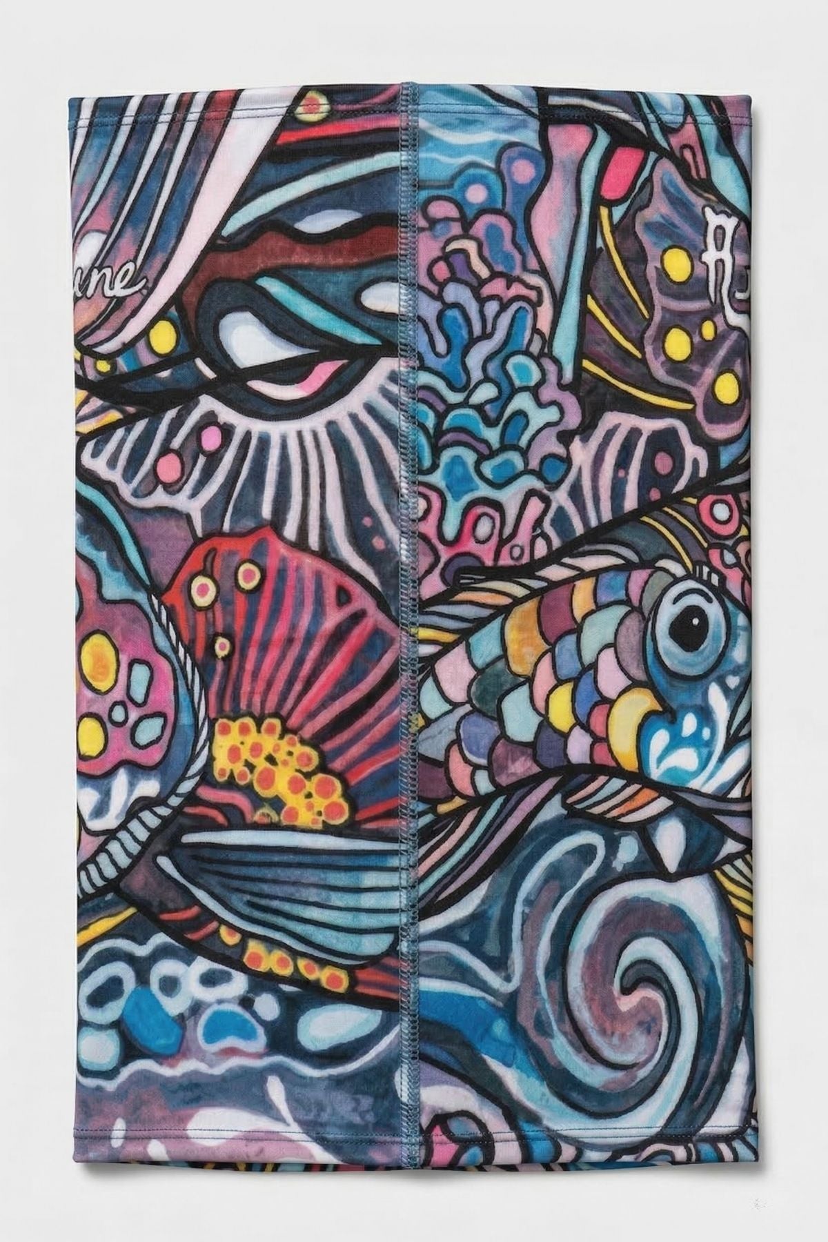Colorful fish design on a towel with abstract patterns