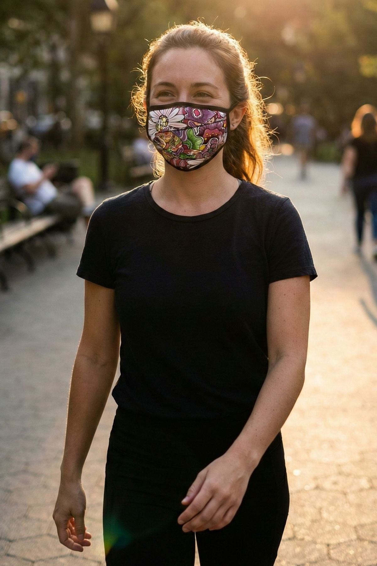 Woman wearing a colorful face mask in an outdoor setting