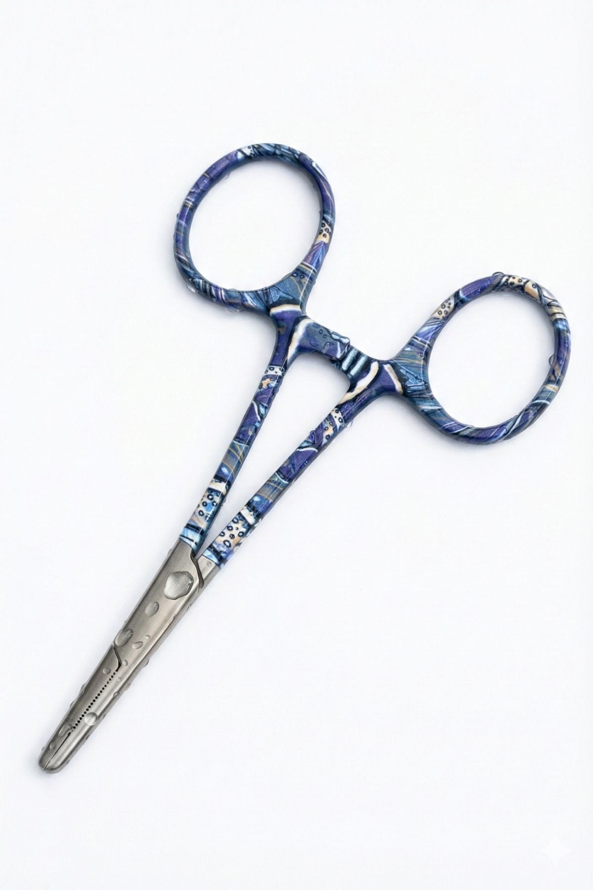 Pair of decorative scissors with blue and silver pattern on a white background