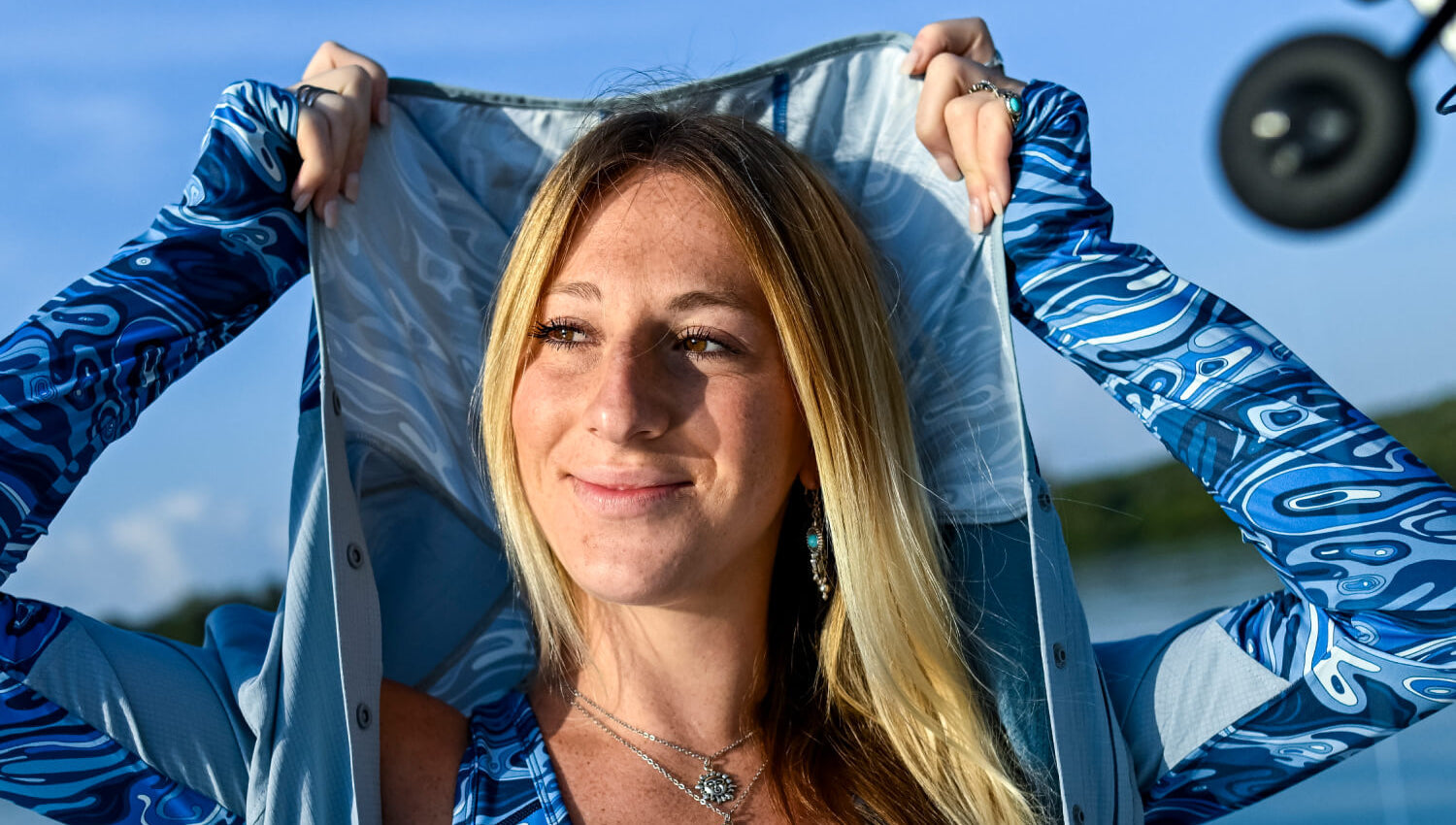 Woman wearing Fishe sun protection clothing for long, bright days outdoors