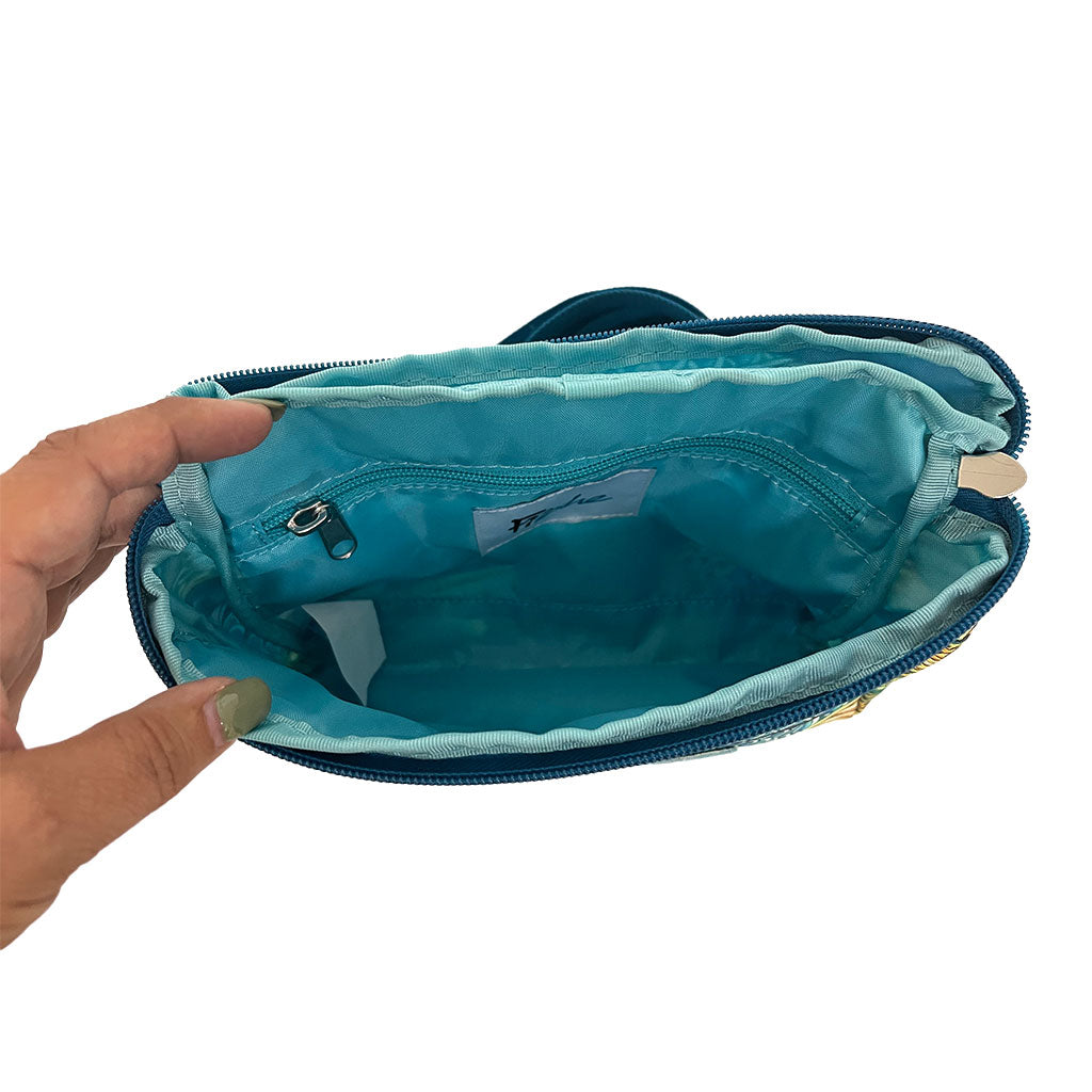 Inside of Kaleido King crossbody bag, teal lined fabric with interior zipped pocket