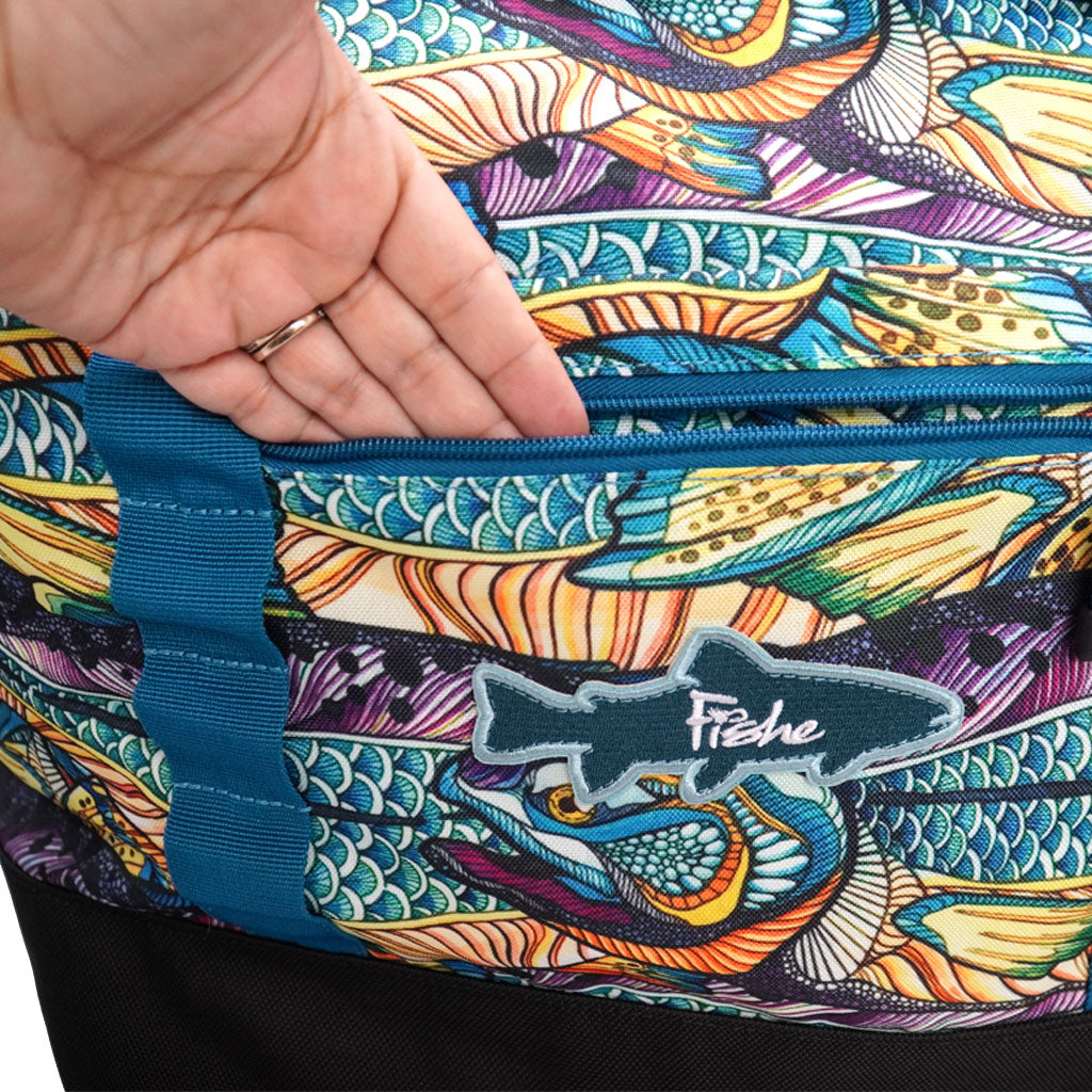 Close up of hand inserted into a zip pocket of the Fishe Kaleido King Weekender Bag