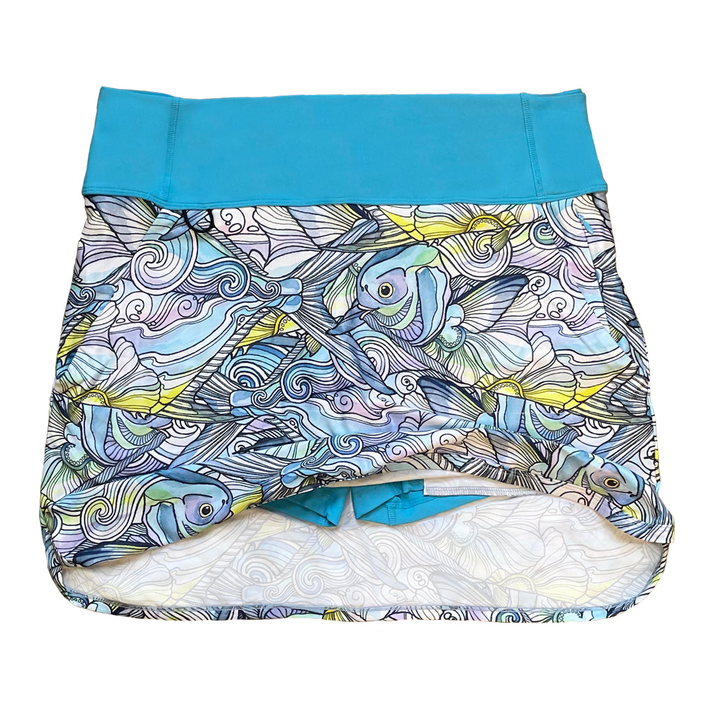Skort featuring the Permit Paradise design with a blue high waist band. Under shorts peeking through 