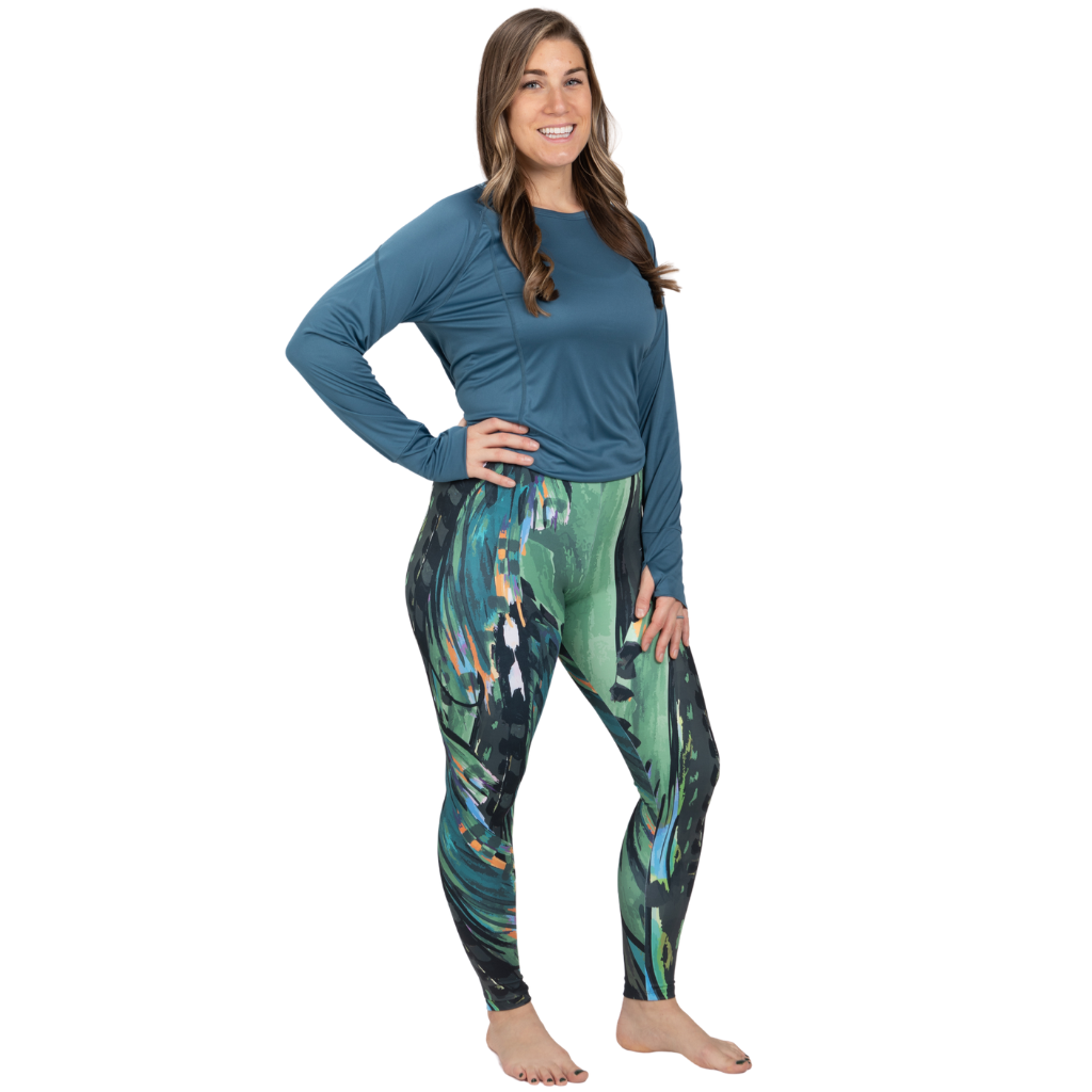A frontal view of the SoFly signature legging the legging has a fly type pattern using the colors green, purple, black and dashes of orange.